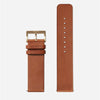 A brown leather Nixon watch band.